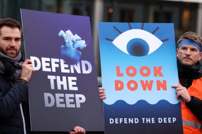 Pictured are activists protesting deep sea mining.
