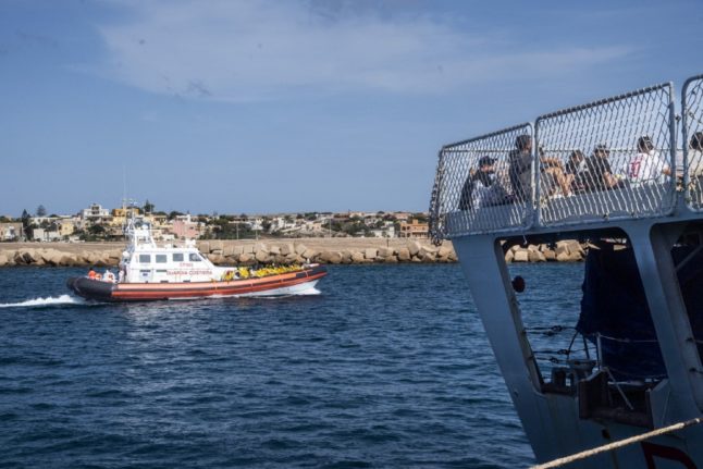 Migrants pictured on a Guardia di Finanza ship off the coast of Italy's Lampedusa island