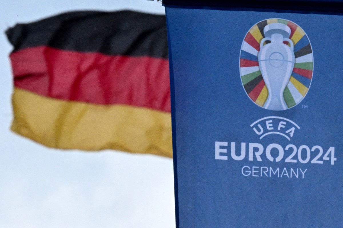 The logo of the UEFA Euro 2024 European Football Championship is pictured on a flag on display in the city centre of Frankfurt am Main, western Germany on May 22, 2024. 