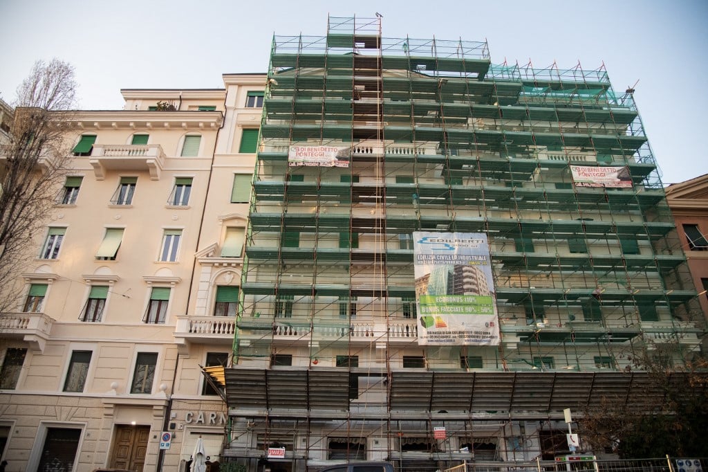 Scaffolding on the facade of a building undergoing renovation work in Rome