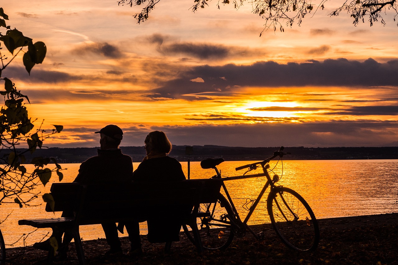 A couple enjoy the sunset at Lake Constance.
