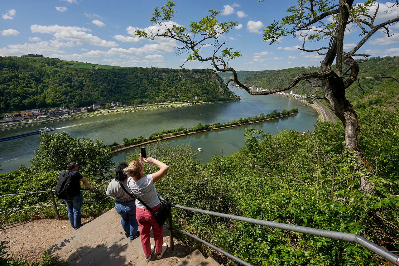 Tourists take photographs of the scenic view atop Loreley, Germany