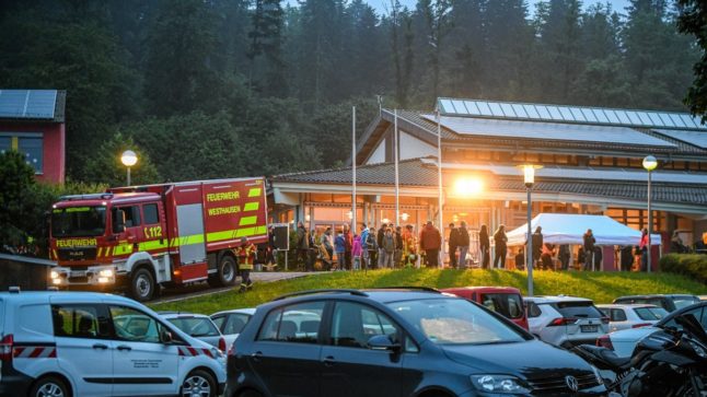 Evacuees reach emergency accommodation in Täferrot, Baden-Württemberg on Monday.