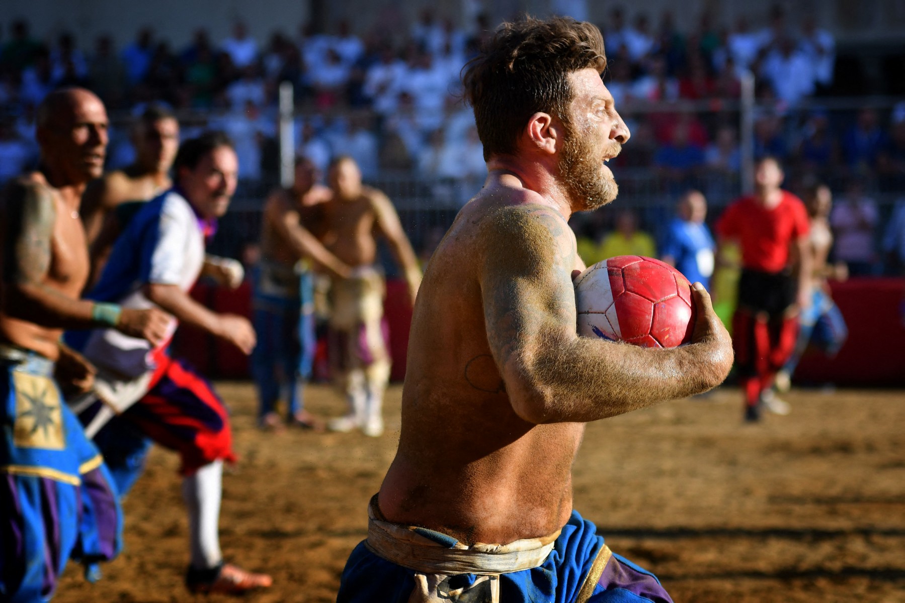 Players pictured during a Calcio Storico match in Florence