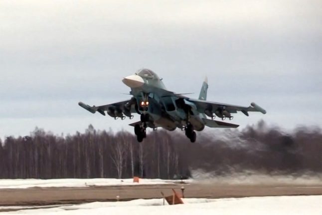 This video grab from handout footage released by the Russian Defence Ministry on March 6, 2022 shows a Russian Sukhoi Su-34 fighter-bomber taking off amid Russia's ongoing military operation in Ukraine