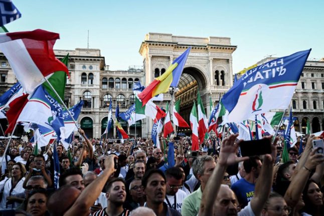 Supporters of Italian PM Giorgia Meloni's Fratelli d'Italia party attend a rally in Piazza Duomo in Milan