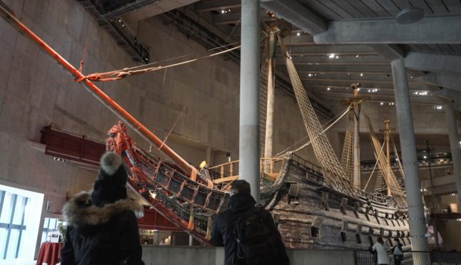 Visitors walk in front of the Vasa warship at the The Vasa Museum in Stockholm