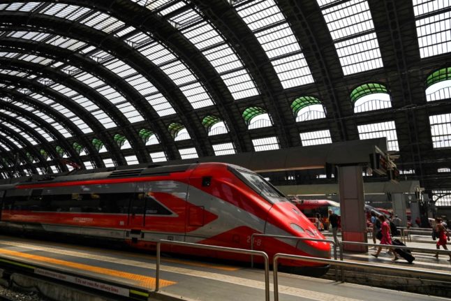 A Freccia Rossa high-speed train stationed at Milan's Stazione Centrale