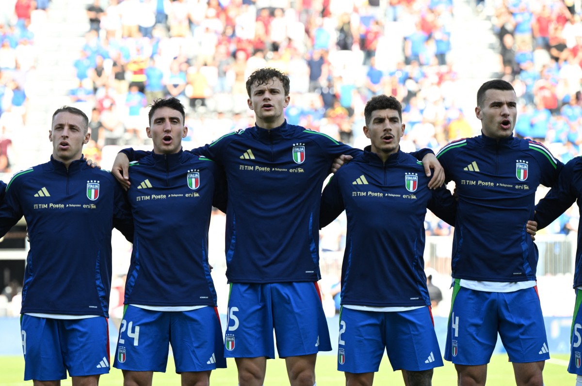 Players of the Italian national football team sing the national anthem prior to a match against Venezuela