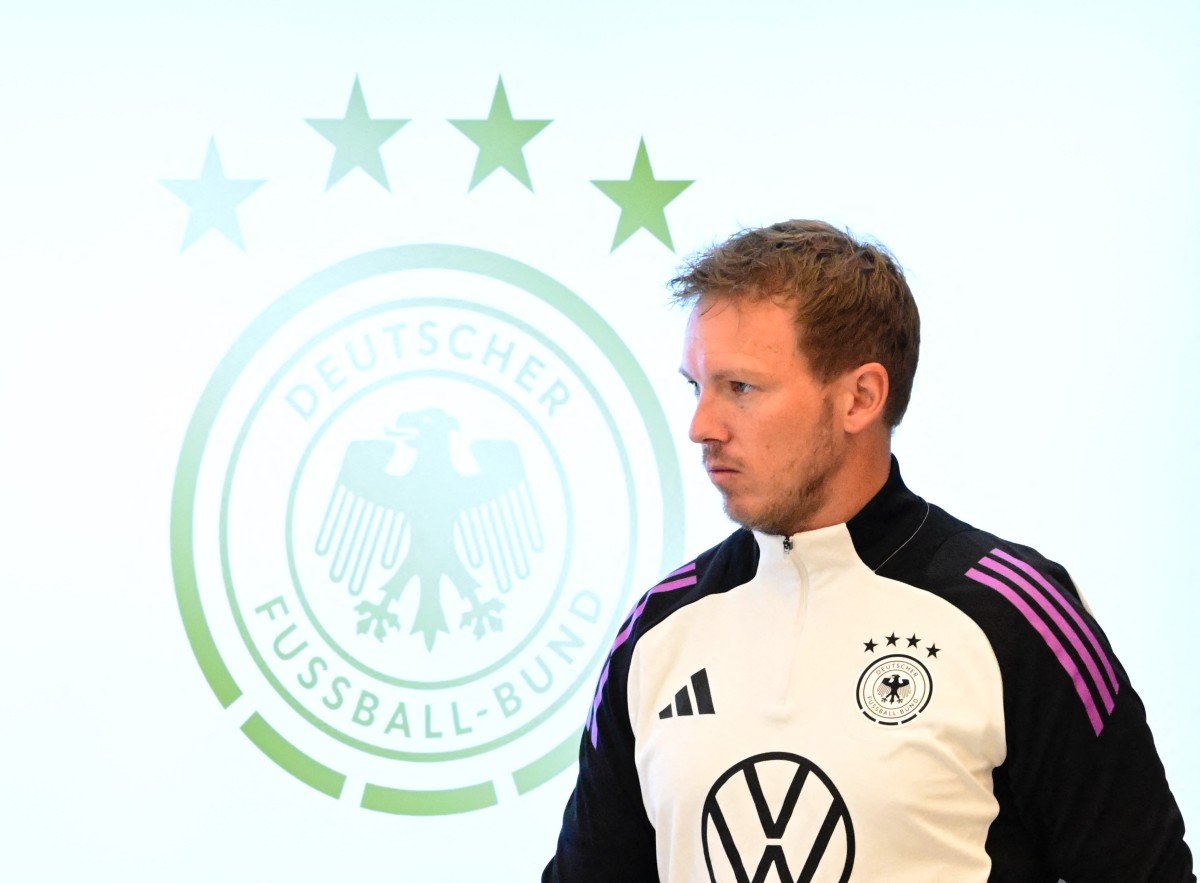 Germany's head coach Julian Nagelsmann arrives for a press conference on the eve of the friendly football match Germany v Ukraine, in Herzogenaurach on June 2, 2024.