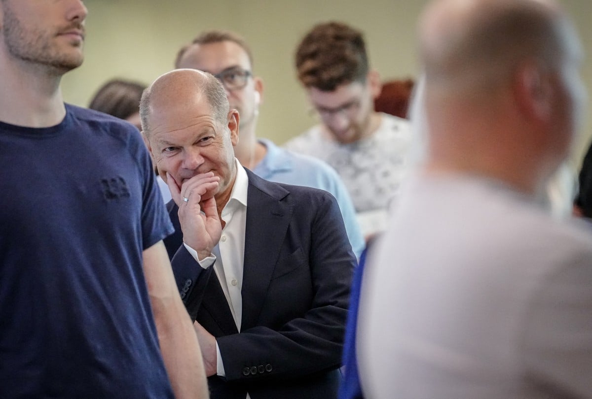 German Chancellor Olaf Scholz of the Social Democratic Party (SPD) queues in a line to cast his vote for the European Parliament Elections at a polling station in Potsdam, eastern Germany, on June 9, 2024.