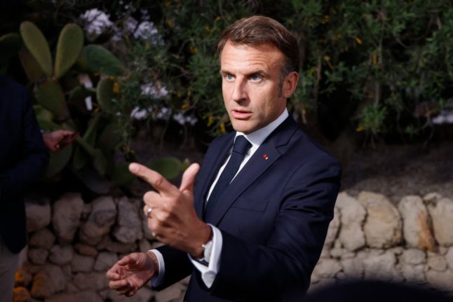 French President Emmanuel Macron gestures as he speaks to the media during the G7 Summit at the Borgo Egnazia resort in Savelletri, near Bari, Italy