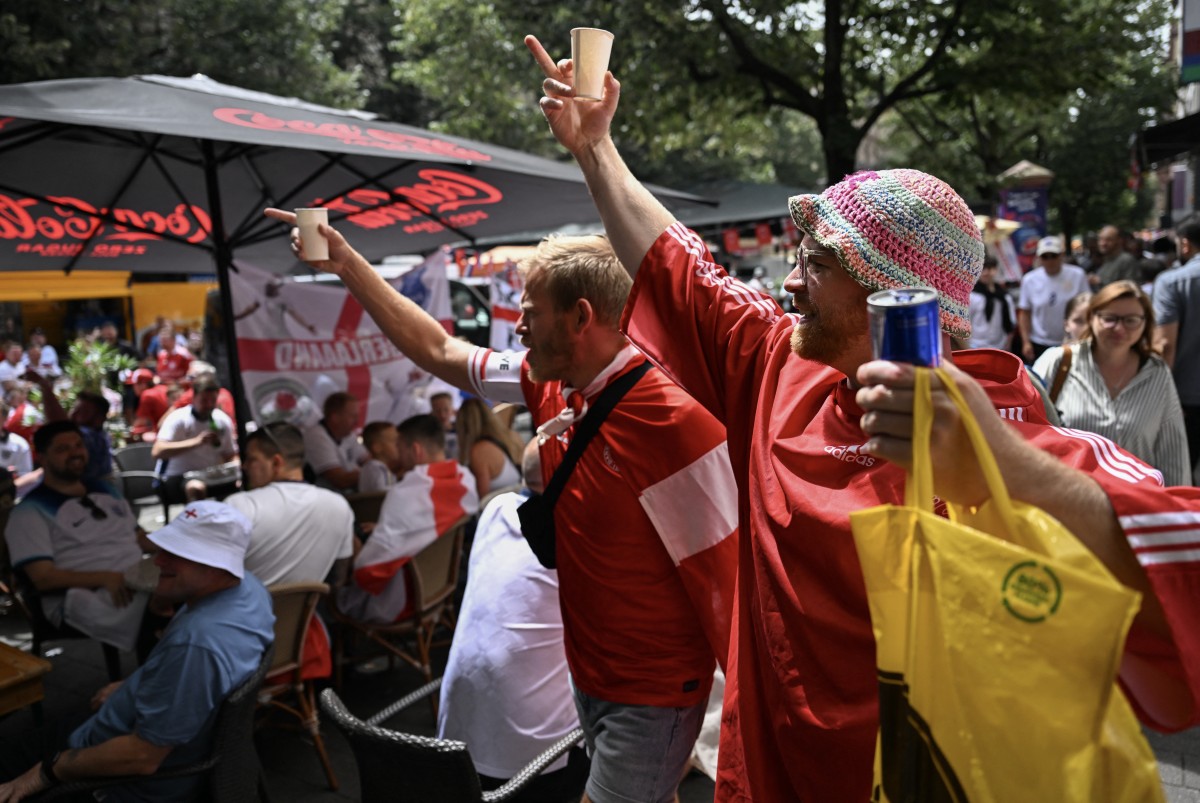 Denmark supporters cheer in front of a group of England supporters in Frankfurt on June 20th. 