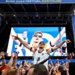 German fans dance to the tune of the ‘saxophone guy’