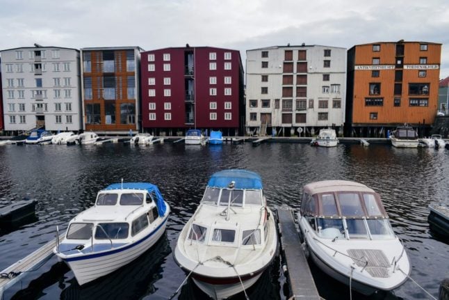 Pictured is a row of boats in Trondheim.