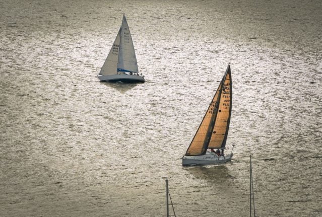 Pictured is a pair of sail boats.