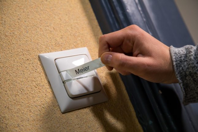 The name on a doorbell is changed in Germany