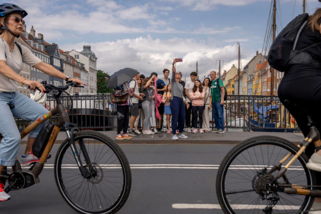 Tourists taking a selfie at Nyhavn, Copenhagen