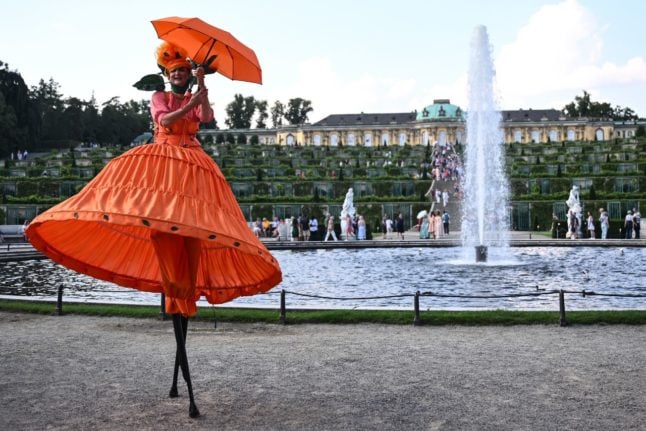 An acrobat performs outside Schloss Sansoucci in Potsdam.