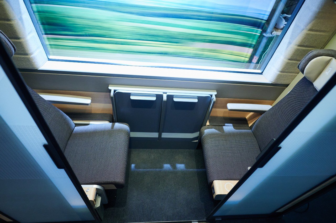 A two-person compartment on a modern ICE train in German