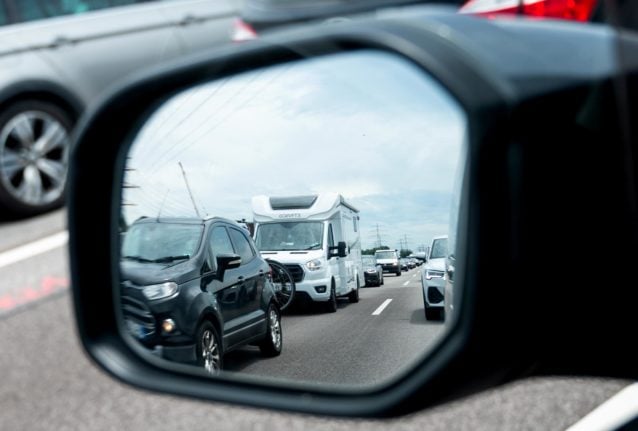 Traffic jams reflected in the rear-view mirror on the A7 near Hamburg