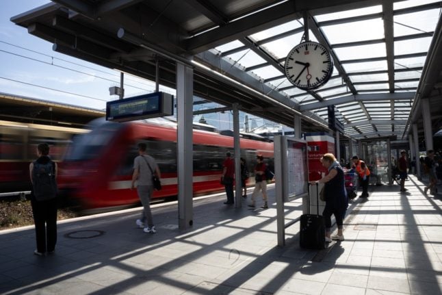 A Deutsche Bahn train departs from a platform in Berlin.