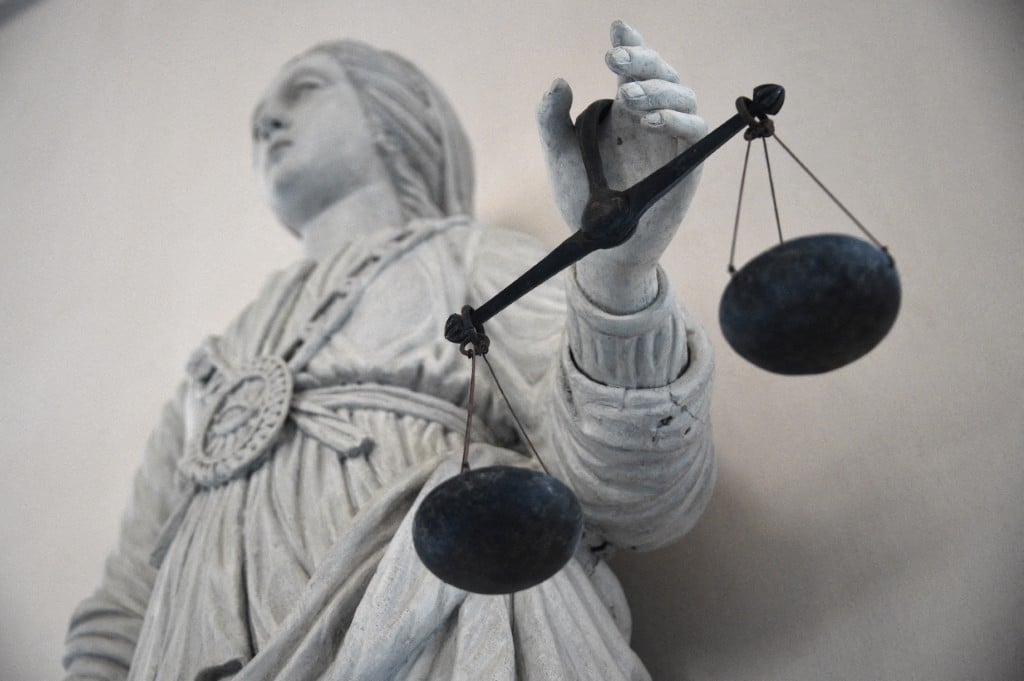 A statue of the goddess of Justice balancing the scales