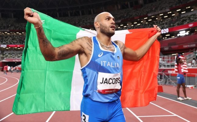 Italy's Marcell Jacobs celebrates after winning the men's 100-metre final at the Tokyo 2020 Olympic Games