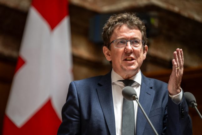 Swiss federal councillor Albert Rösti attends a session of the parliament in Bern in 2023.