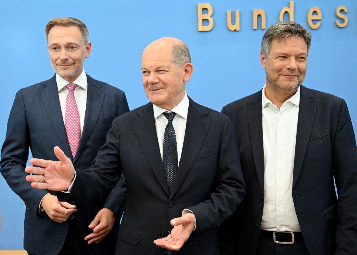 German Finance Minister Christian Lindner, German Chancellor Olaf Scholz and German Minister of Economics and Climate Protection Robert Habeck arrive to deliver a press conference on July 5, 2024 in Berlin, after the three parties in Germany's ruling coalition struck an agreement on the 2025 budget.