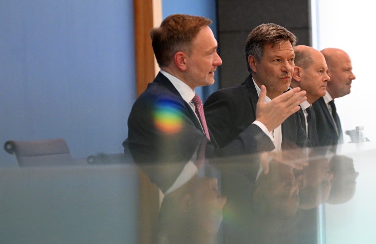 German Finance Minister Christian Lindner, Minister of Economics Robert Habeck and German Chancellor Olaf Scholz deliver a press conference on July 5, 2024 in Berlin, after the three parties in Germany's ruling coalition struck an agreement on the 2025 budget. 