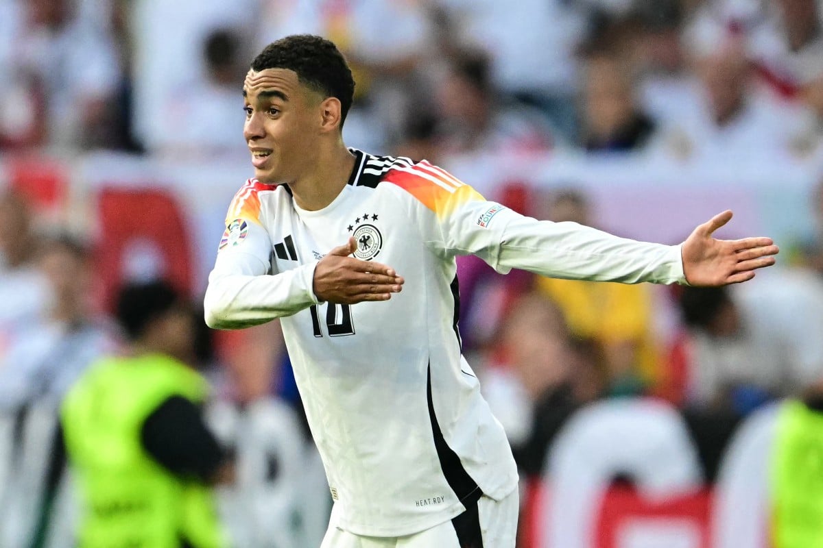 Germany's midfielder #10 Jamal Musiala gestures during the UEFA Euro 2024 quarter-final football match between Spain and Germany in Stuttgart on July 5, 2024.