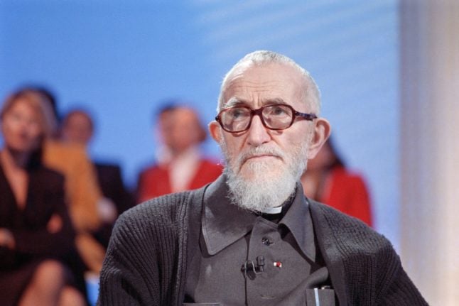 This file photo shows founder of Emmaüs, French Catholic priest Abbé Pierre, attending TV programme 