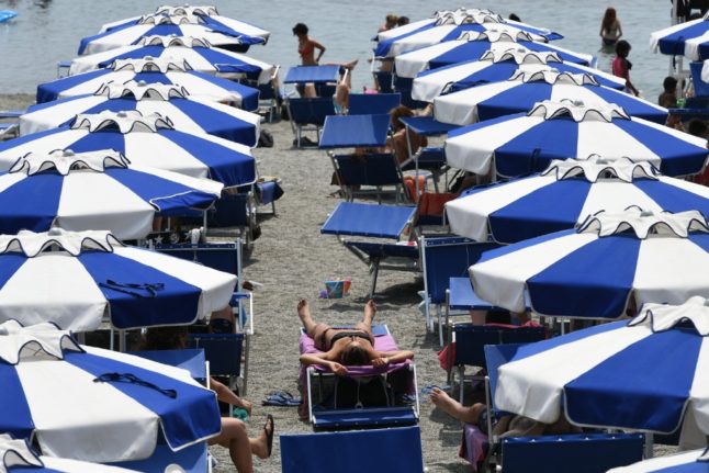 Beachgoers pictured at Liguria's Varazze beach, northern Italy