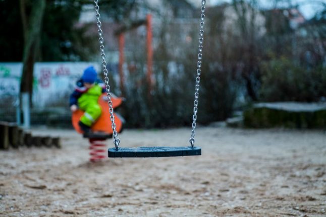 Pictured is a child using a playground.