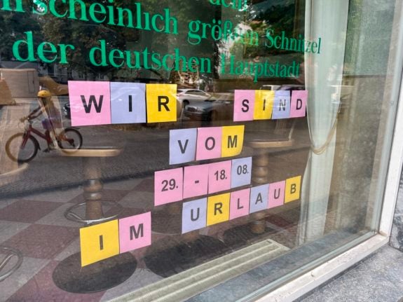 A restaurant in Berlin with a holiday notice on the window.