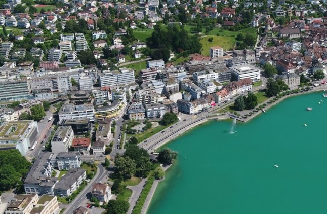 Why will Zug cut its residents' health insurance premiums?