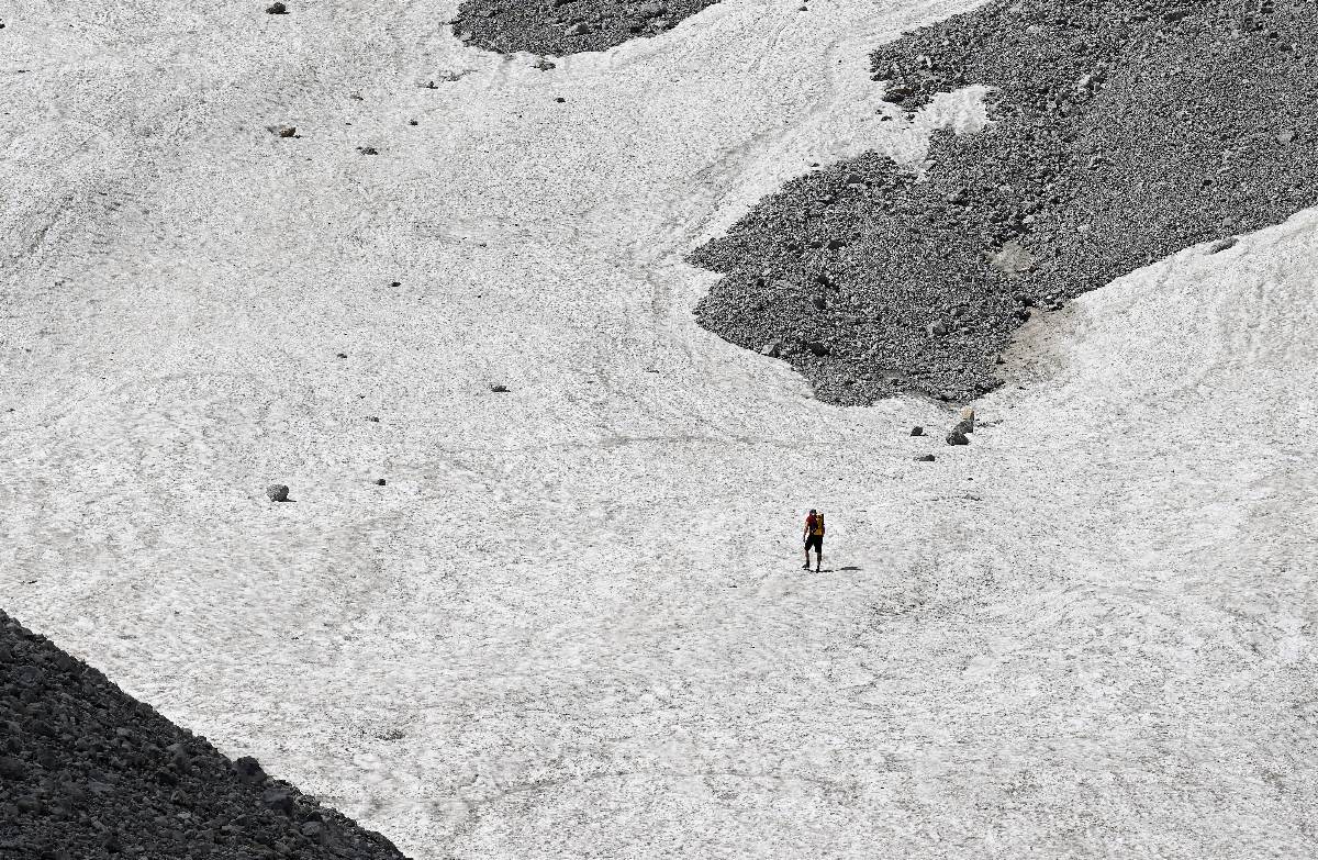 People walk near the Watzmann glacier in 2023.