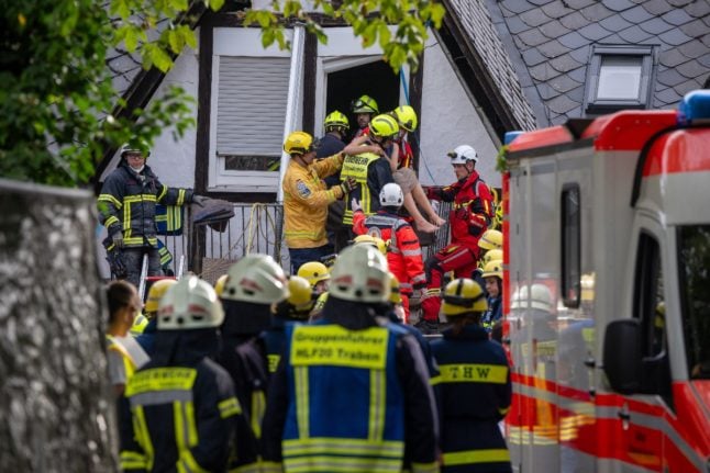 A person is rescued from the collapsed hotel.