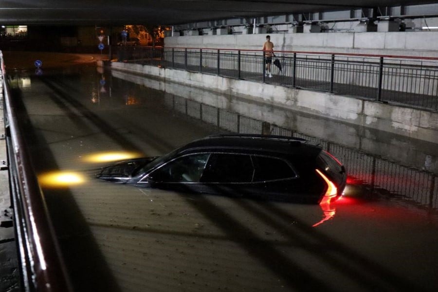 German battered by storms and floods after hottest day of year