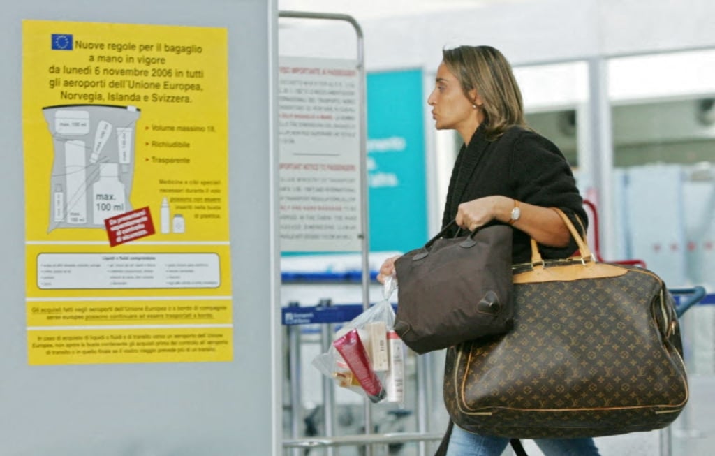 A passenger carrying liquid items in a plastic bag at Rome Fiumicino Airport