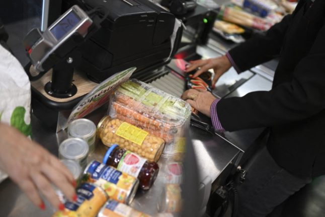 Pictured is a supermarket checkout.