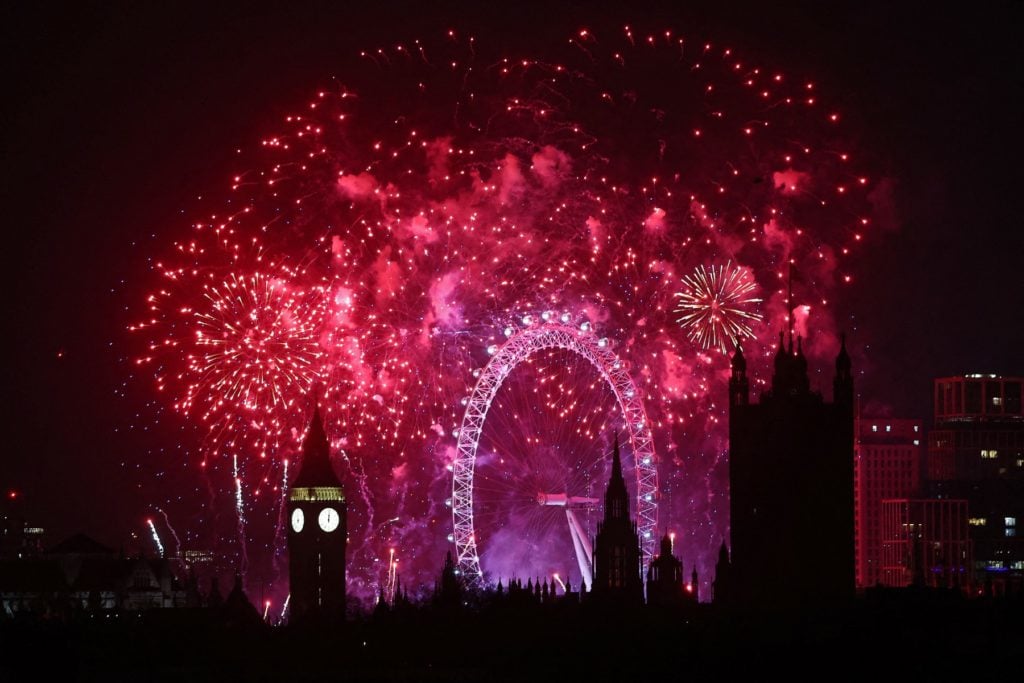 Fireworks explode around the London Eye