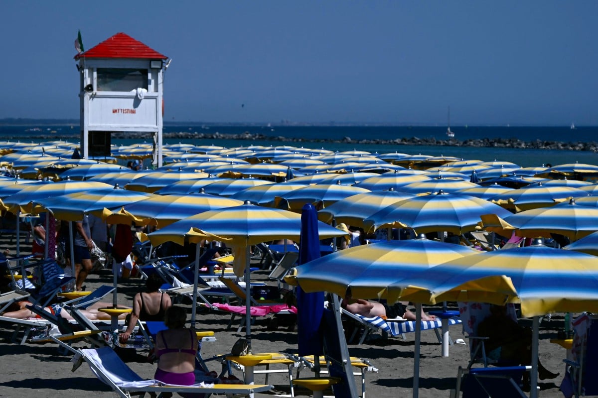 People pictured at a private beach in Italy's Lazio region