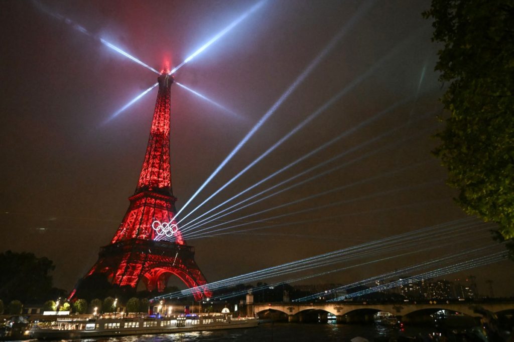 Lights illuminate the Eiffel Tower during the opening ceremony of the Paris 2024 Olympic Games