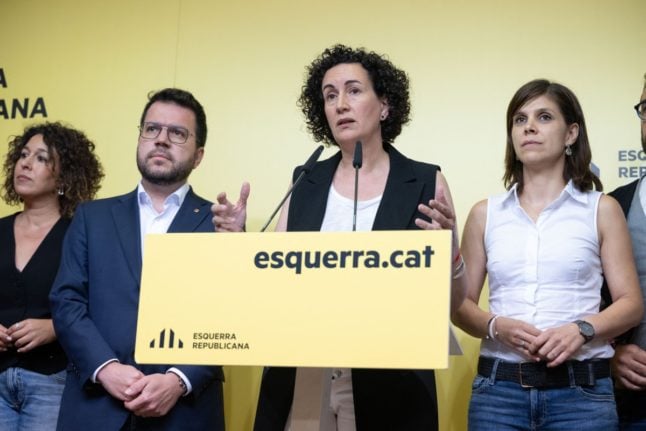 ERC acting Secretary General Marta Rovira (2R) speaks alongside Catalan regional president Pere Aragones (2L) during a press conference at the party's headquarters in Barcelona, Catalonia