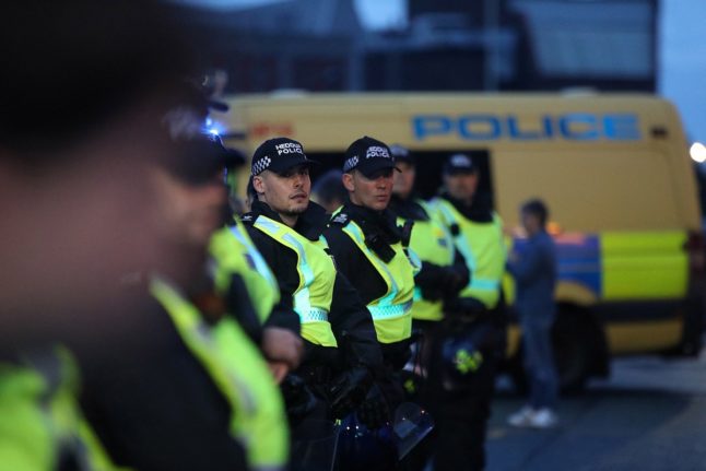 Police officers stand guard outside the Abdullah Quilliam Mosque in Liverpool amid demonstrations called in reaction to fatal stabbings in Southport on July 29th