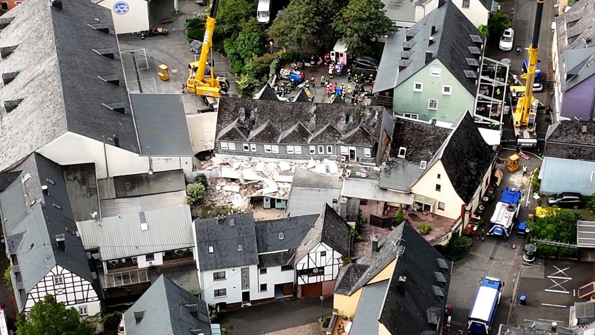 Video grab taken from an aerial video footage shows rescuers working in and around a hotel that partly collapsed on August 7, 2024 in Kröv, western Germany, killing two people and injuring several others.