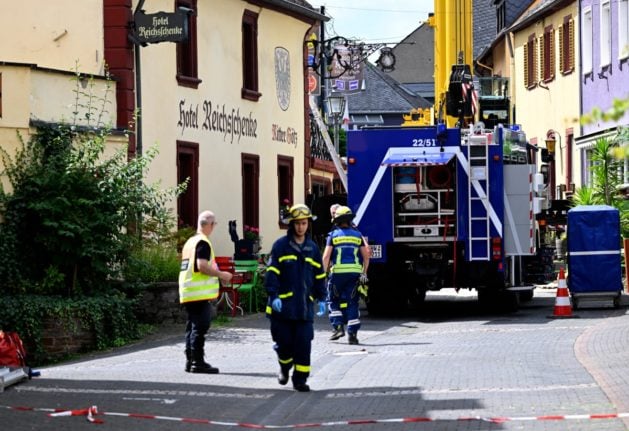 Rescue teams work in Kroev, western Germany, on August 7, 2024 close to a hotel that partly collapsed, killing two people and injuring several others.