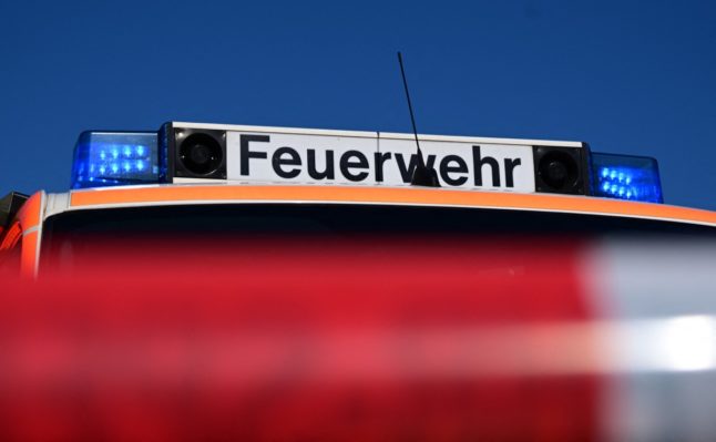 The flashing blue lights on a vehicle of the fire brigade - Feuerwehr.